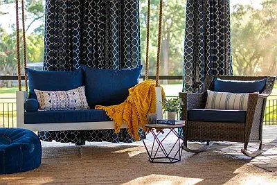 Twin Size Porch Daybed Swing with White Sunbrella Cushions and Tan Outdoor Safavieh Rug