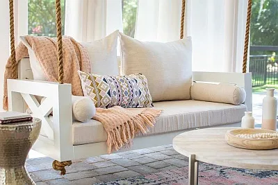 Pretty in Pink. White Porch Swing with Pink accent Loloi Accent Rug