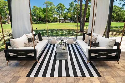 Pool Daybed Swing in White with Teak furniture and Couristan Dolce Flower Rug